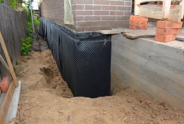 Happy homeowners after waterproofing job in Euclid